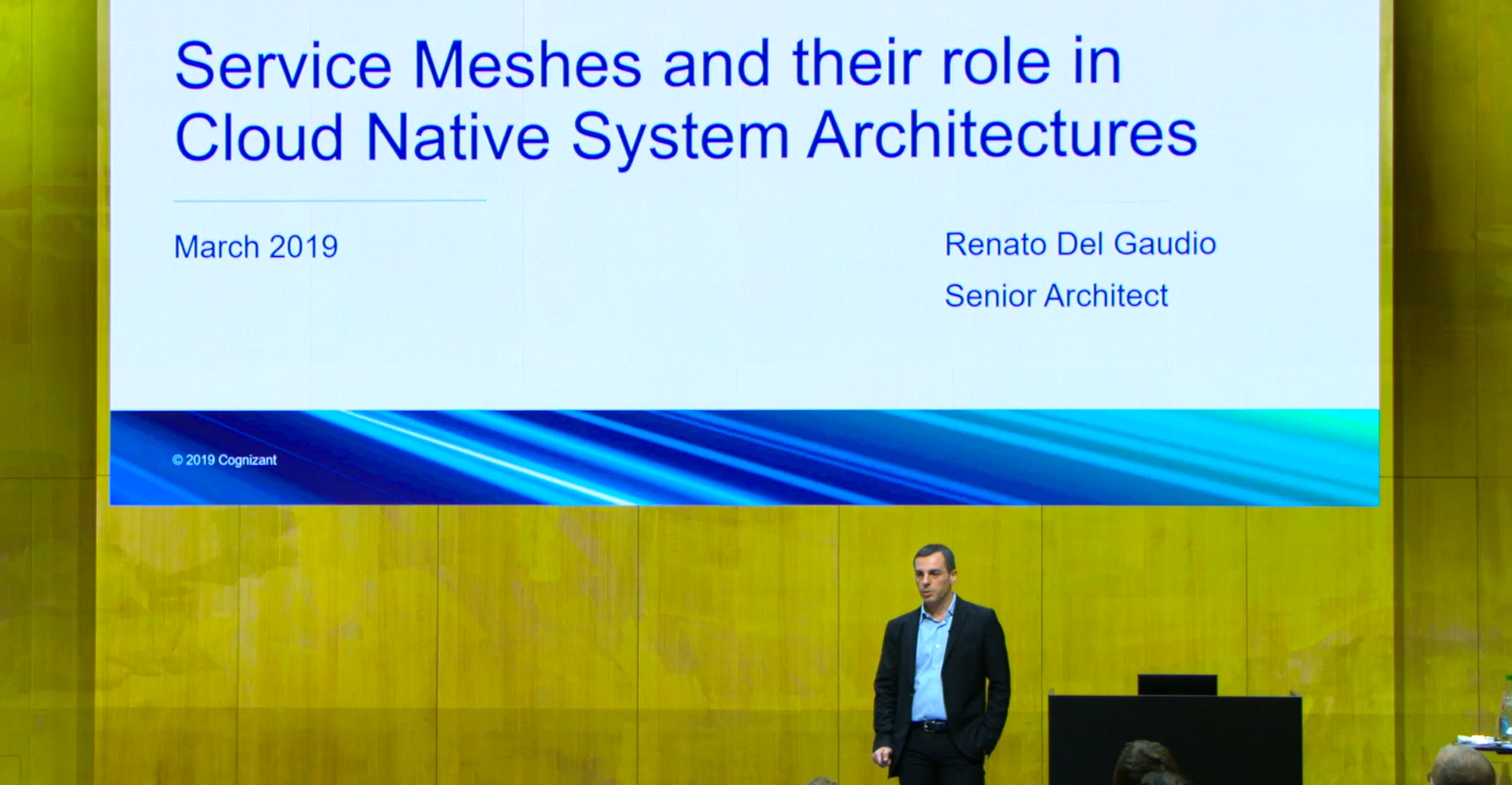 Renato Del Gaudio speaking at a technical conference on Service Mesh in microservice architecture